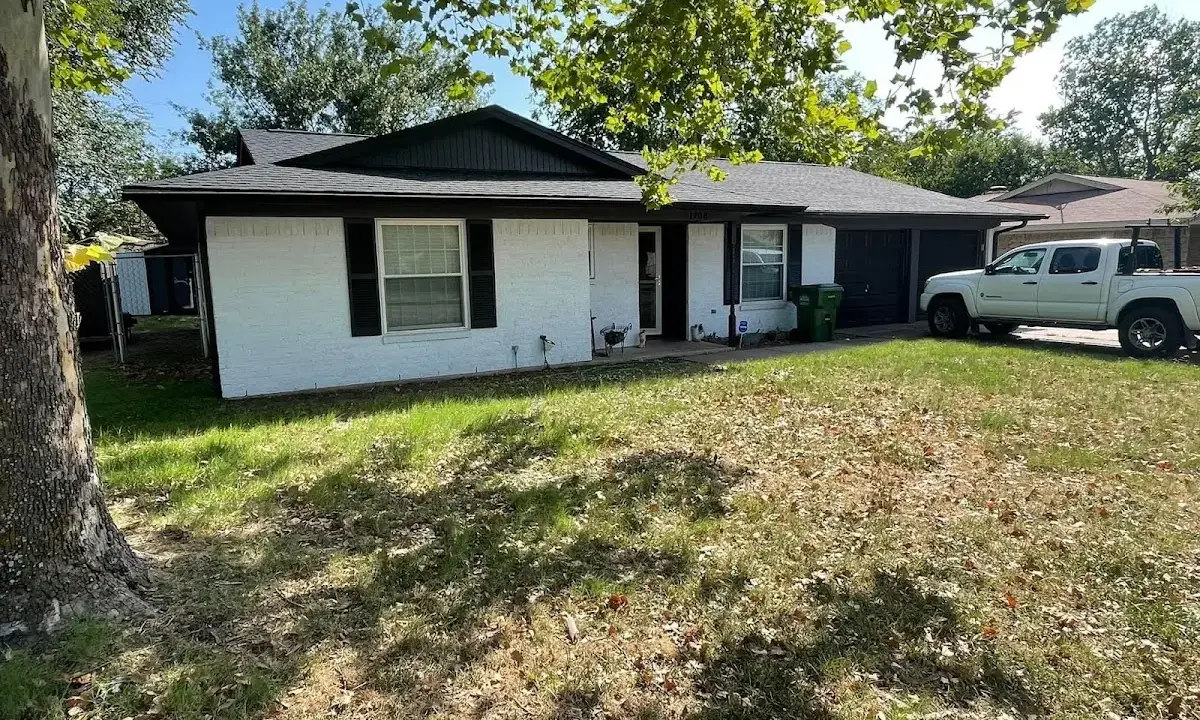 Professional roofing crew working on a residential roof in Jerseyville